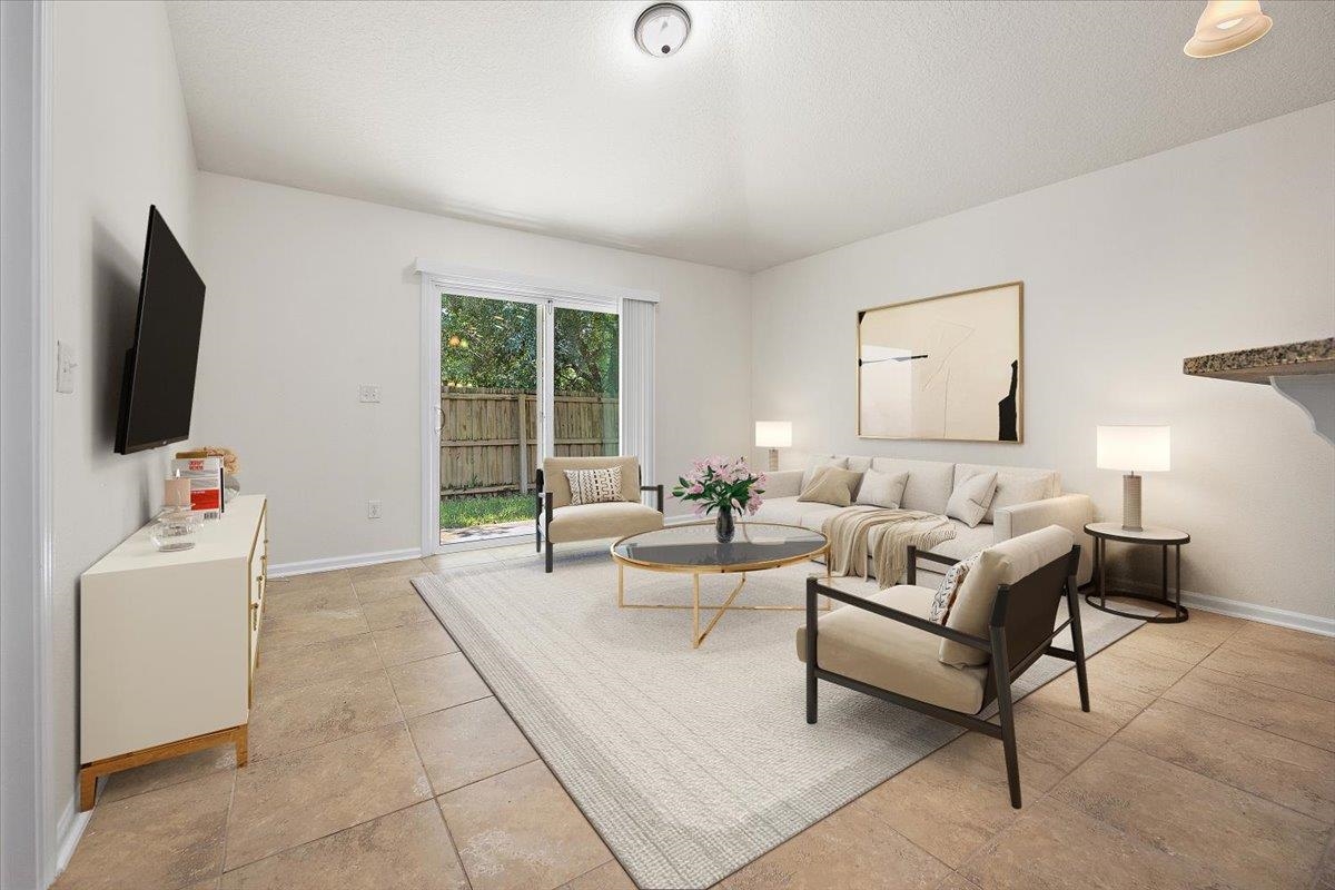 161 Fallen Timber Way St. Augustine, FL 32084 - Photo 10 of 20 a living room with furniture and a flat screen tv
