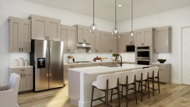 a kitchen with stainless steel appliances kitchen island granite countertop a dining table chairs and a refrigerator