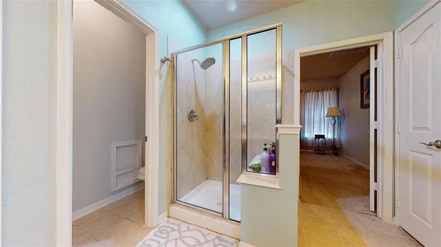 a view of a bathroom from a hallway