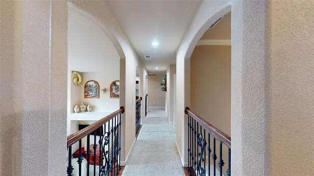 a view of a hallway view with staircase