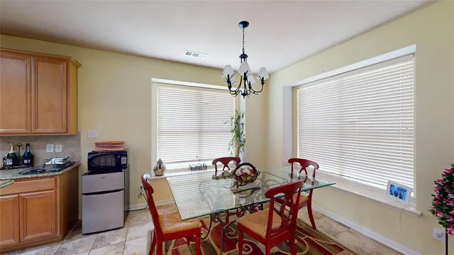 a view of a dining room with furniture window and outside view