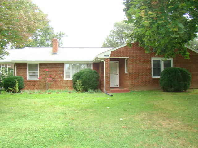 285 Blue Ridge Drive Blue Ridge, VA 24064 - Photo 1 of 46 a backyard of a house with plants and large tree