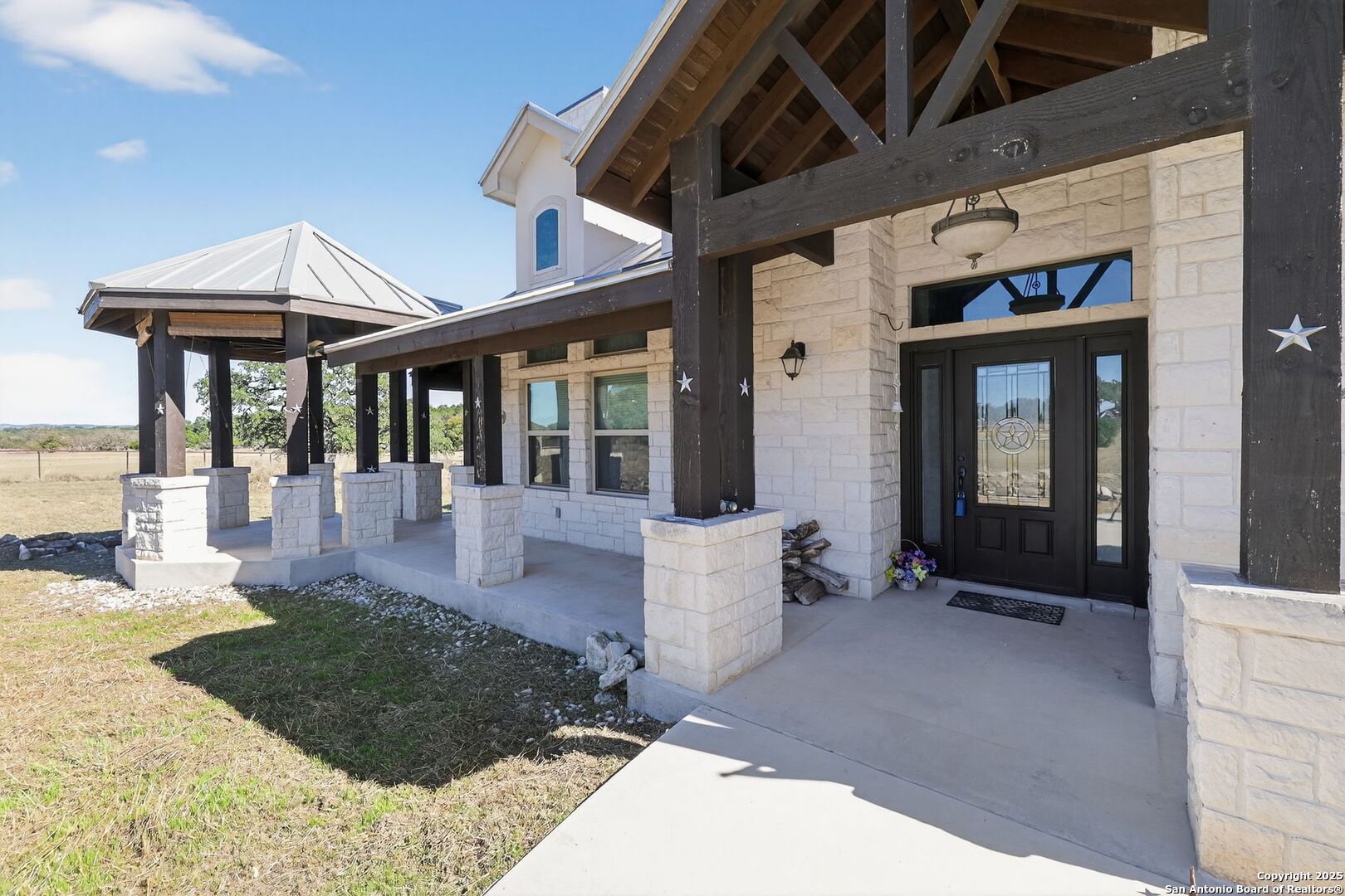 101 Lucky Bandera, TX 78003 - Photo 2 of 42 a view of a patio with table and chairs and potted plants