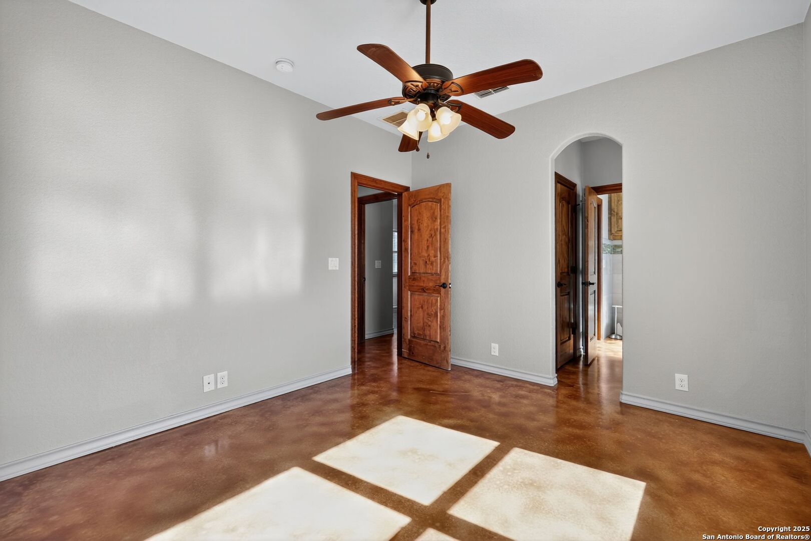 101 Lucky Bandera, TX 78003 - Photo 22 of 42 an empty room with closet and a chandelier fan