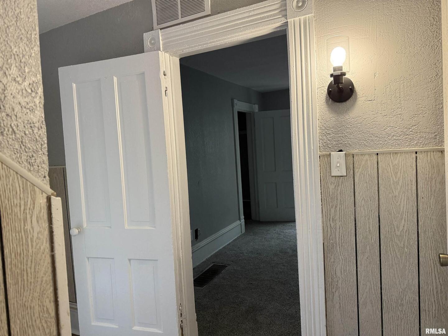 2104 Pershing Boulevard Clinton, IA 52732 - Photo 12 of 14 a view of a mirror and cabinets in a room