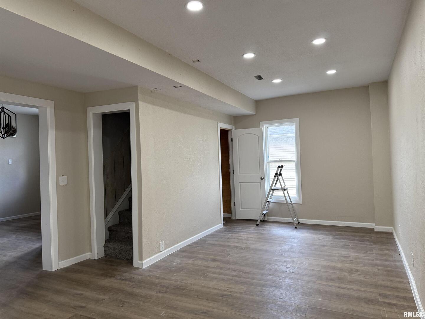 2104 Pershing Boulevard Clinton, IA 52732 - Photo 4 of 14 a view of empty room with wooden floor