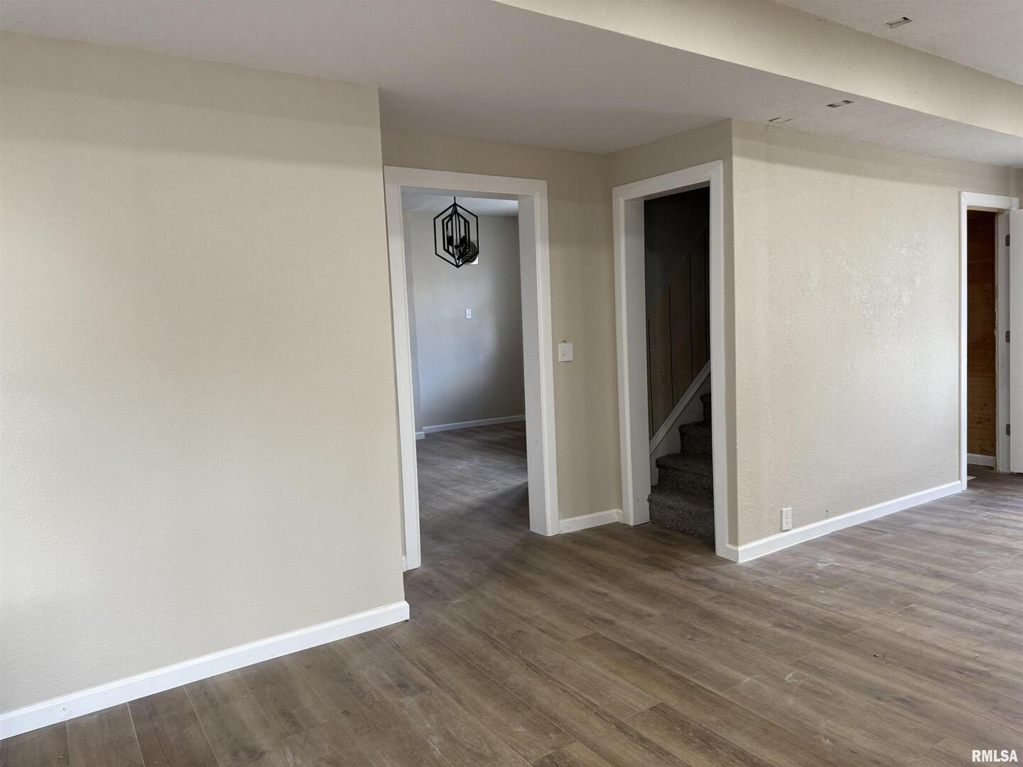 2104 Pershing Boulevard Clinton, IA 52732 - Photo 5 of 14 a view of a hallway with wooden floor
