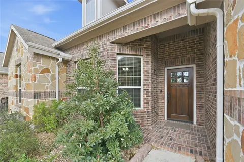 a view of house with outdoor space and swimming pool