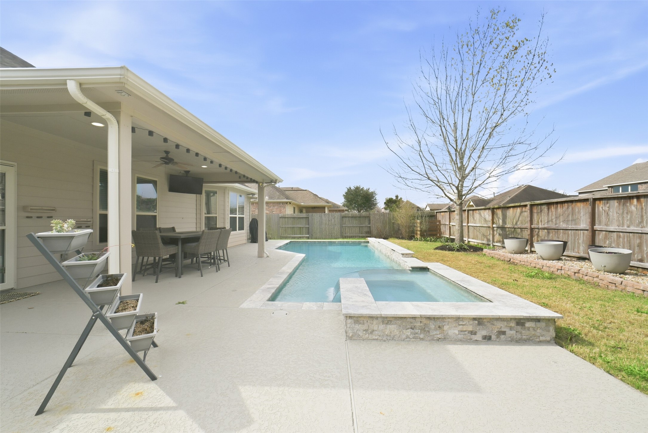 30014 Valley Terrace Drive Fulshear, TX 77406 - Photo 1 of 36 Slip out back to your own oasis! The pool/spa was built in 2021 with a waterfall feature and infinity edge hot tub.