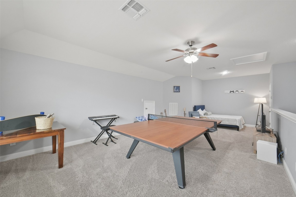 30014 Valley Terrace Drive Fulshear, TX 77406 - Photo 25 of 35 a living room with furniture and a table