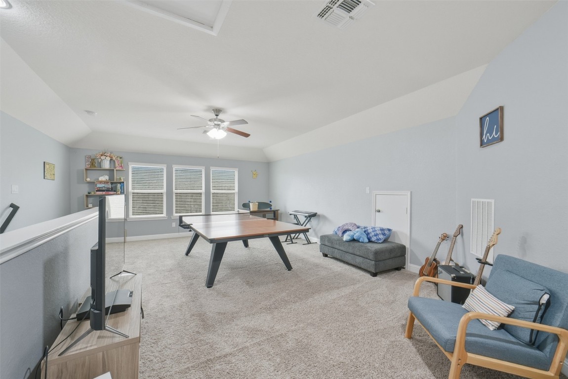 30014 Valley Terrace Drive Fulshear, TX 77406 - Photo 26 of 35 The game room is light and bright from the three double pane windows.