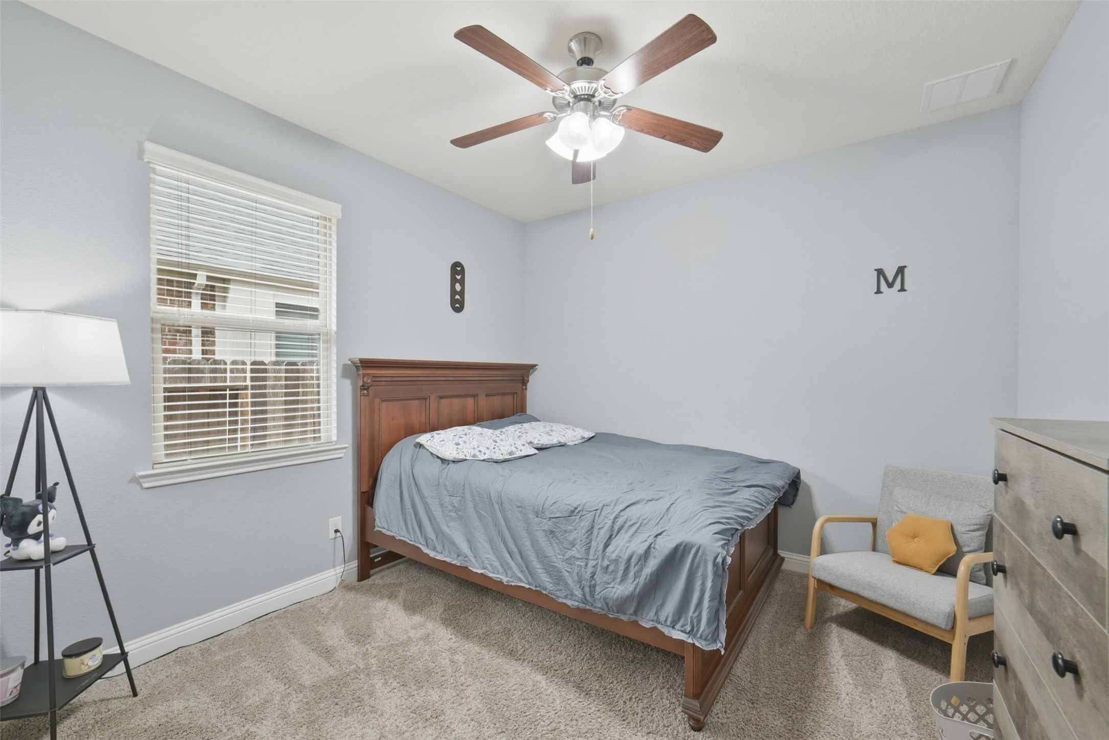 30014 Valley Terrace Drive Fulshear, TX 77406 - Photo 27 of 36 Back downstairs you will find bedroom #2 which includes carpet floors and a ceiling fan.