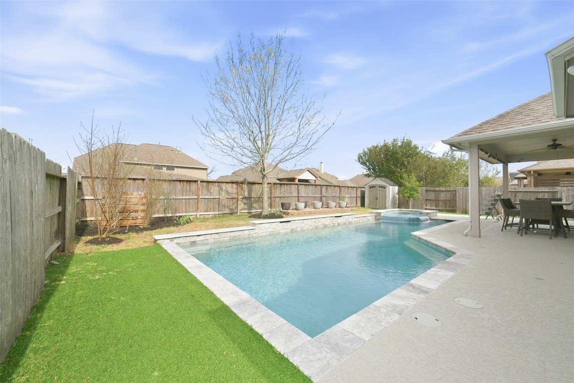 30014 Valley Terrace Drive Fulshear, TX 77406 - Photo 33 of 35 a view of a swimming pool with a patio