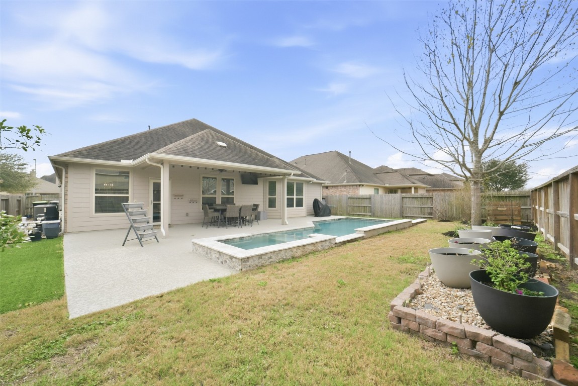 30014 Valley Terrace Drive Fulshear, TX 77406 - Photo 35 of 35 a front view of a house with swimming pool and sitting area