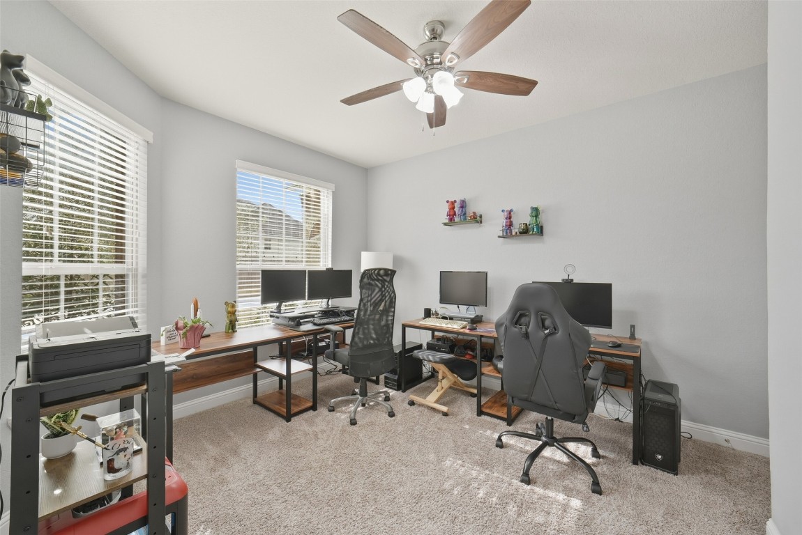 30014 Valley Terrace Drive Fulshear, TX 77406 - Photo 7 of 35 a view of a workspace with furniture and a window