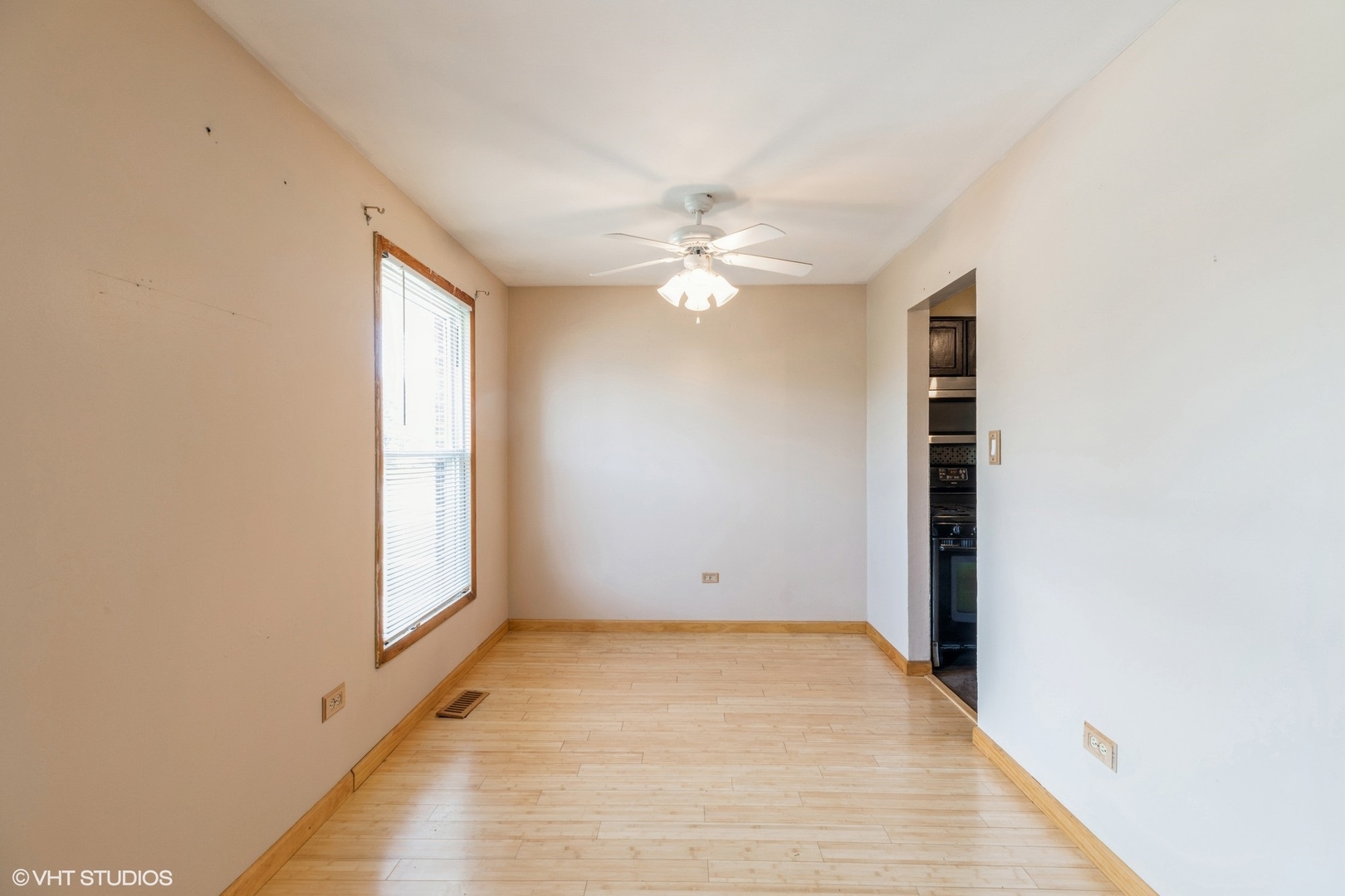 18159 Ravisloe Terrace Country Club Hills, IL 60478 - Photo 5 of 19 an empty room with windows and fan
