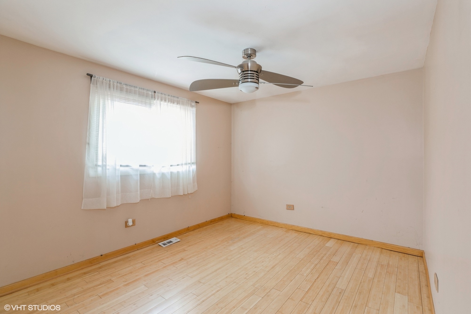 18159 Ravisloe Terrace Country Club Hills, IL 60478 - Photo 6 of 19 a view of empty room with wooden floor and fan