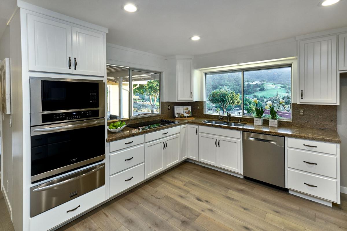 20421 Hunter's Hill Road San Jose, CA 95120 - Photo 19 of 50 a kitchen with stainless steel appliances white cabinets a sink and a stove