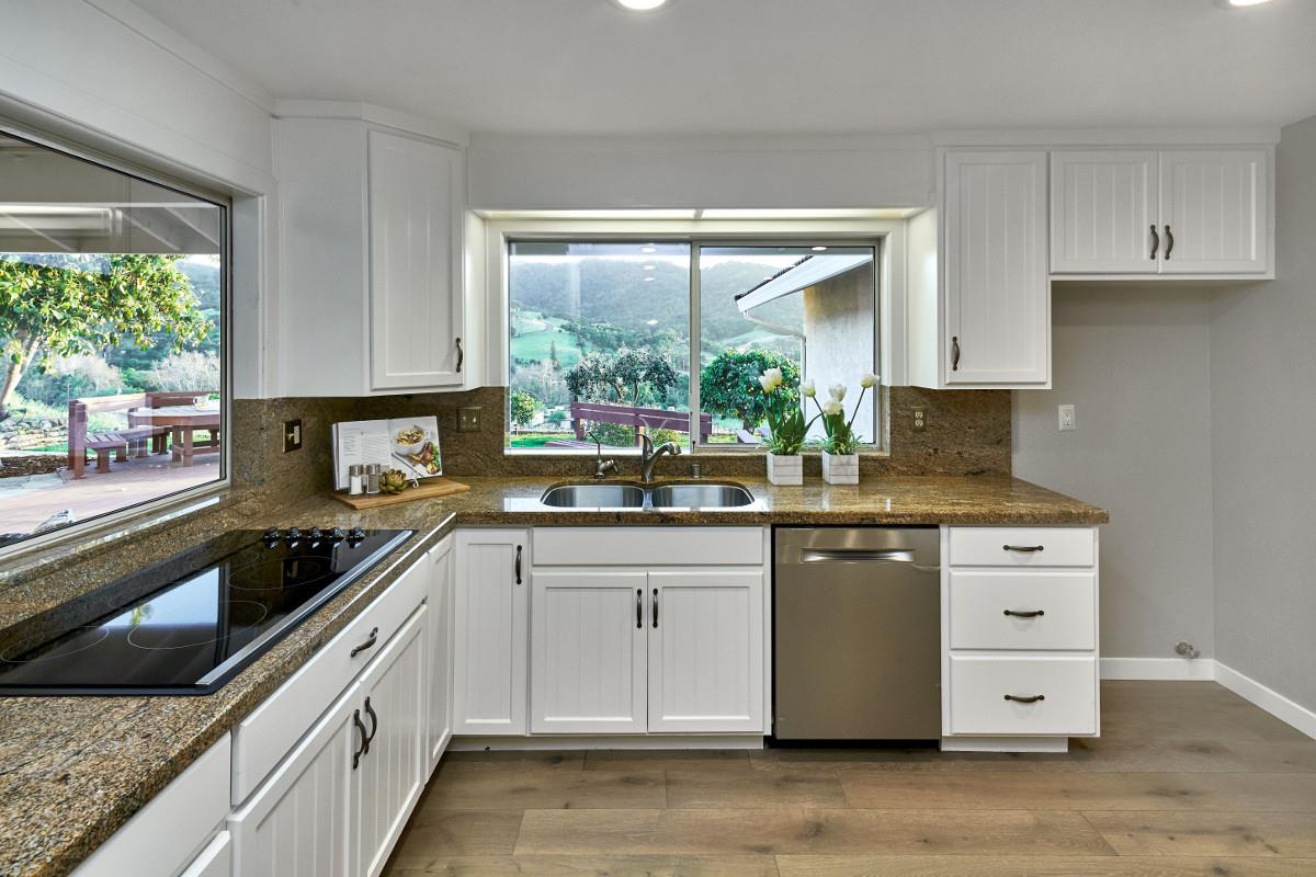 20421 Hunter's Hill Road San Jose, CA 95120 - Photo 20 of 50 a kitchen with stainless steel appliances granite countertop white cabinets and window
