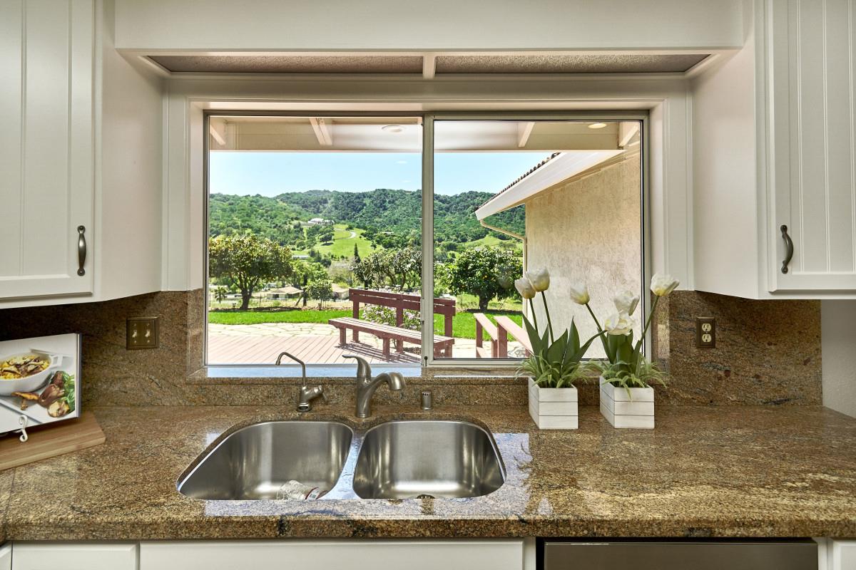 20421 Hunter's Hill Road San Jose, CA 95120 - Photo 23 of 50 a kitchen sink with a granite countertop window and a sink