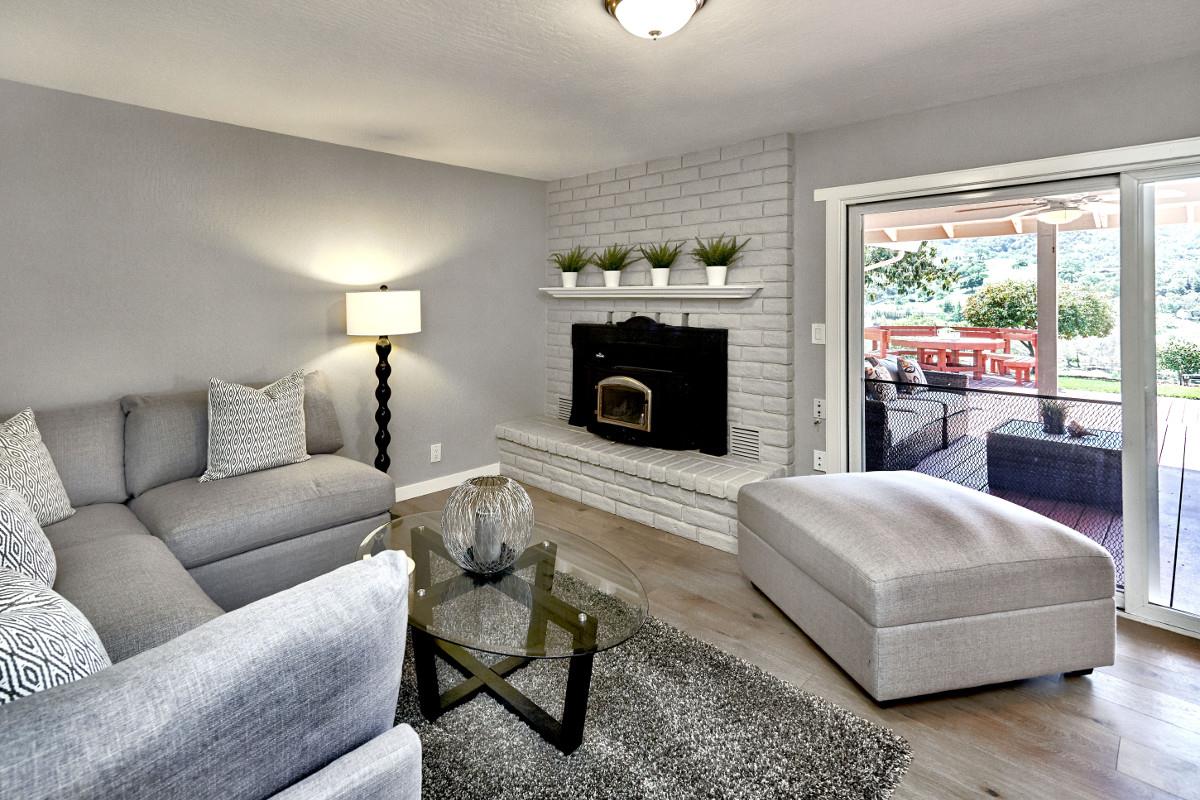 20421 Hunter's Hill Road San Jose, CA 95120 - Photo 26 of 50 a living room with furniture and a fireplace