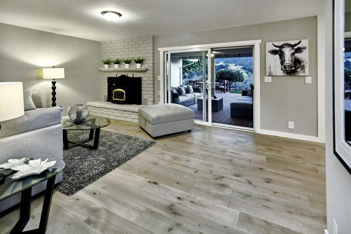 20421 Hunter's Hill Road San Jose, CA 95120 - Photo 27 of 50 a living room with furniture and a fireplace