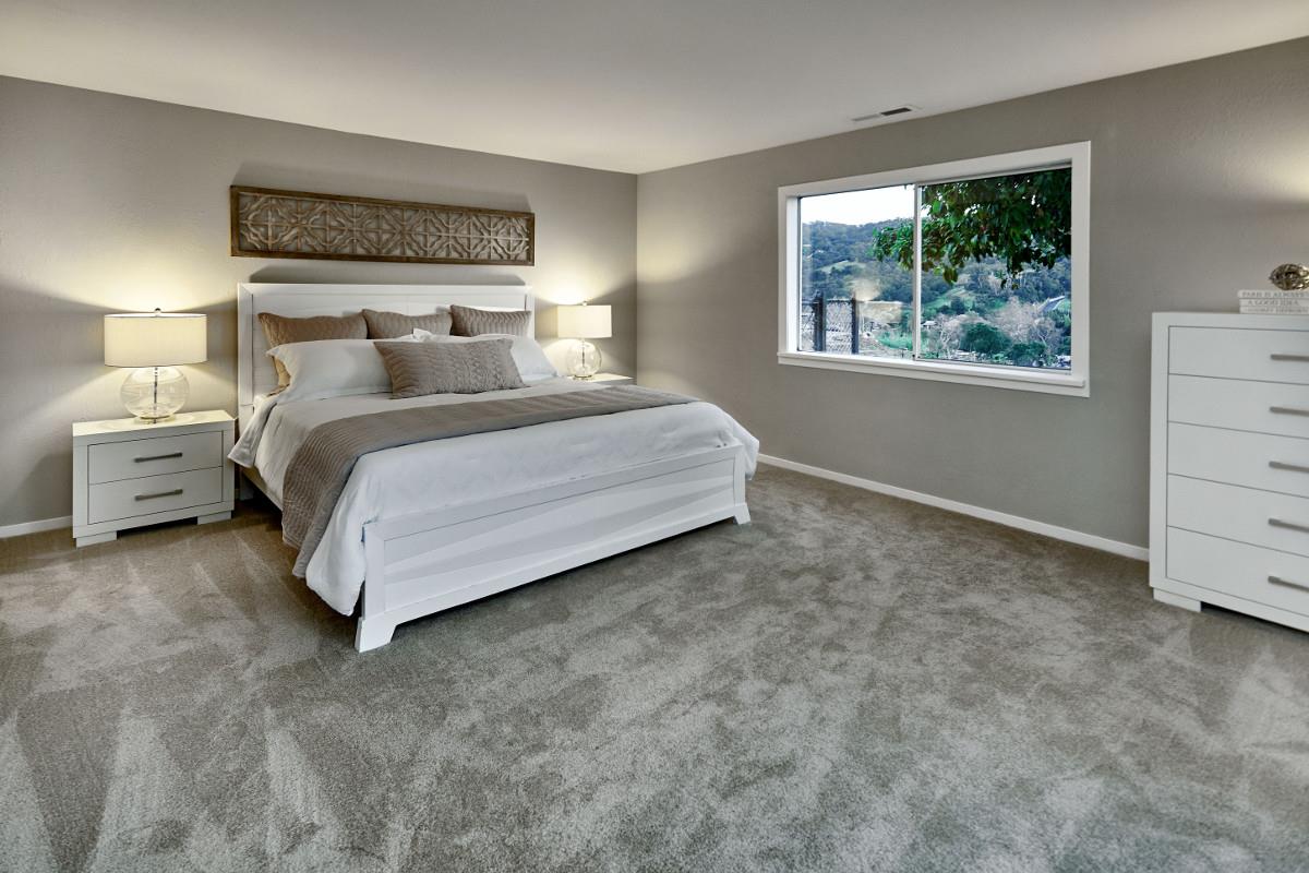 20421 Hunter's Hill Road San Jose, CA 95120 - Photo 28 of 50 a bedroom with a bed and window