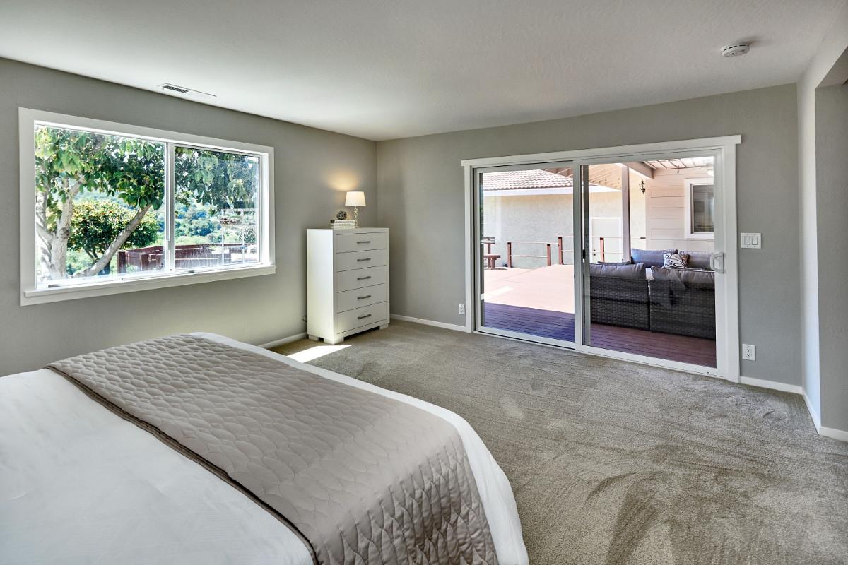 20421 Hunter's Hill Road San Jose, CA 95120 - Photo 29 of 50 a bedroom with a bed and a couch