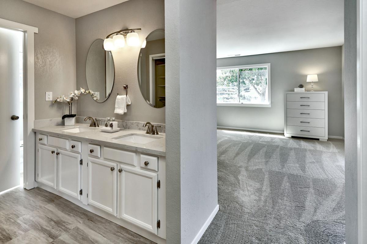 20421 Hunter's Hill Road San Jose, CA 95120 - Photo 31 of 50 a bathroom with a double vanity sink mirror and a