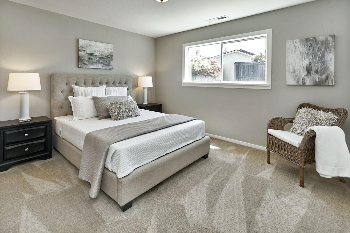 20421 Hunter's Hill Road San Jose, CA 95120 - Photo 34 of 50 a bedroom with a bed and a couch