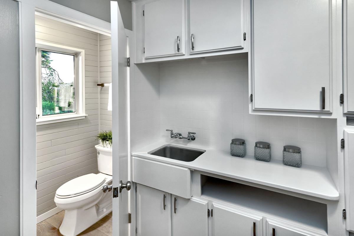 20421 Hunter's Hill Road San Jose, CA 95120 - Photo 39 of 50 a white toilet sitting next to a bathroom sink