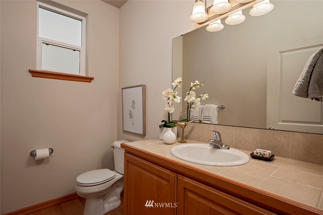 2114 241st Street Southwest Bothell, WA 98021 - Photo 12 of 32 a bathroom with a sink and a toilet