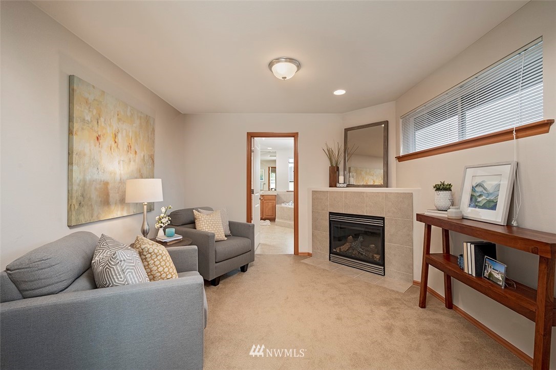 2114 241st Street Southwest Bothell, WA 98021 - Photo 19 of 32 a living room with furniture and a fireplace