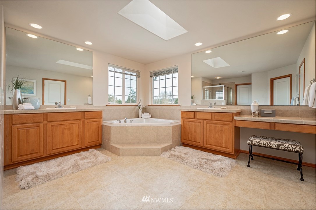 2114 241st Street Southwest Bothell, WA 98021 - Photo 20 of 32 a large bathroom with a large tub and sink