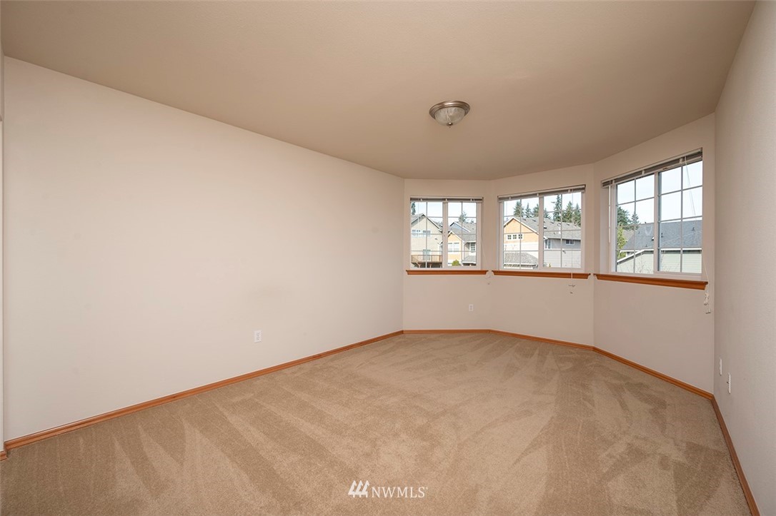 2114 241st Street Southwest Bothell, WA 98021 - Photo 22 of 32 an empty room with windows