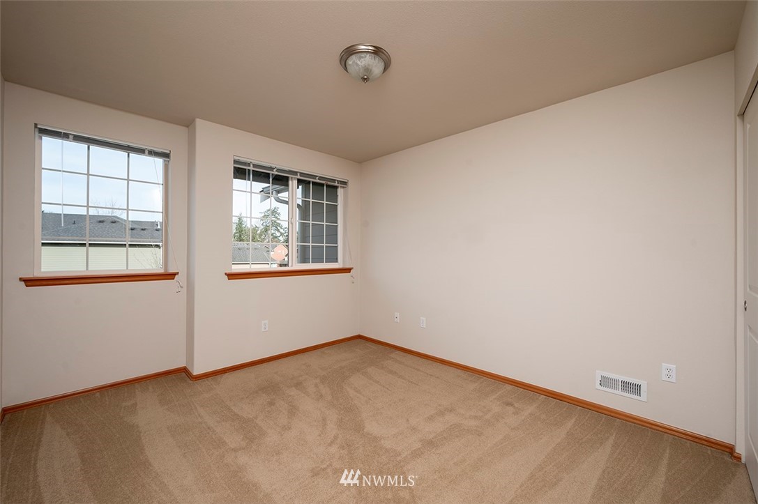 2114 241st Street Southwest Bothell, WA 98021 - Photo 23 of 32 an empty room with windows