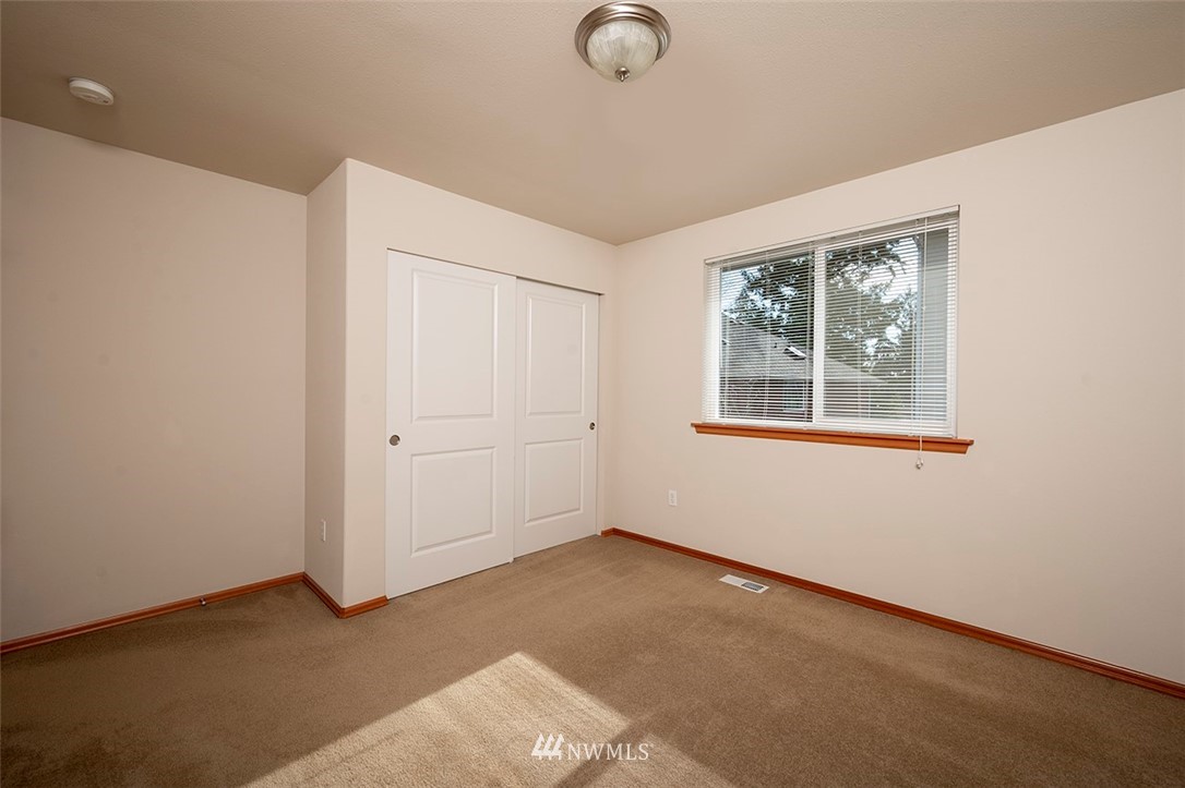 2114 241st Street Southwest Bothell, WA 98021 - Photo 24 of 32 an empty room with windows
