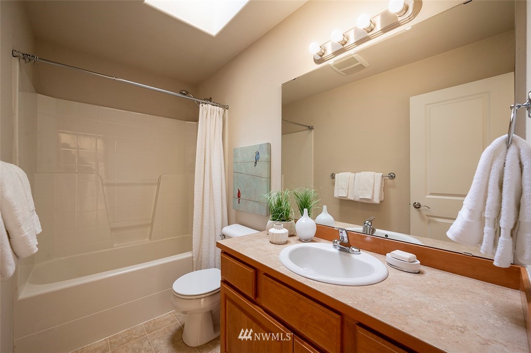 2114 241st Street Southwest Bothell, WA 98021 - Photo 25 of 32 a bathroom with a sink a toilet and shower