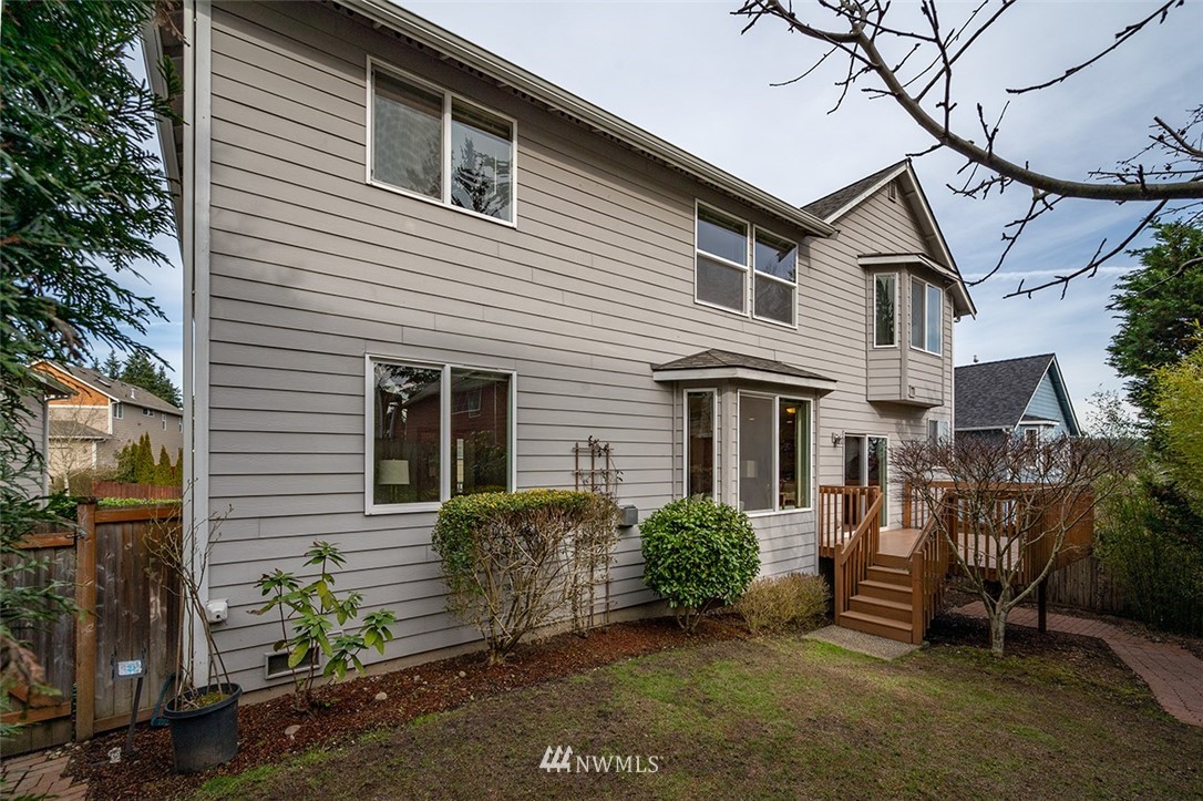 2114 241st Street Southwest Bothell, WA 98021 - Photo 27 of 32 a view of a house with brick walls and a yard