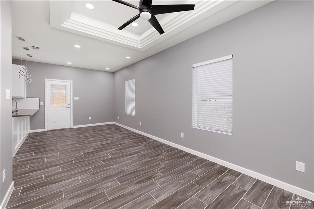 1721 Monaco Drive, Unit 4 San Juan, TX 78589 - Photo 4 of 17 a view of empty room with wooden floor and fan