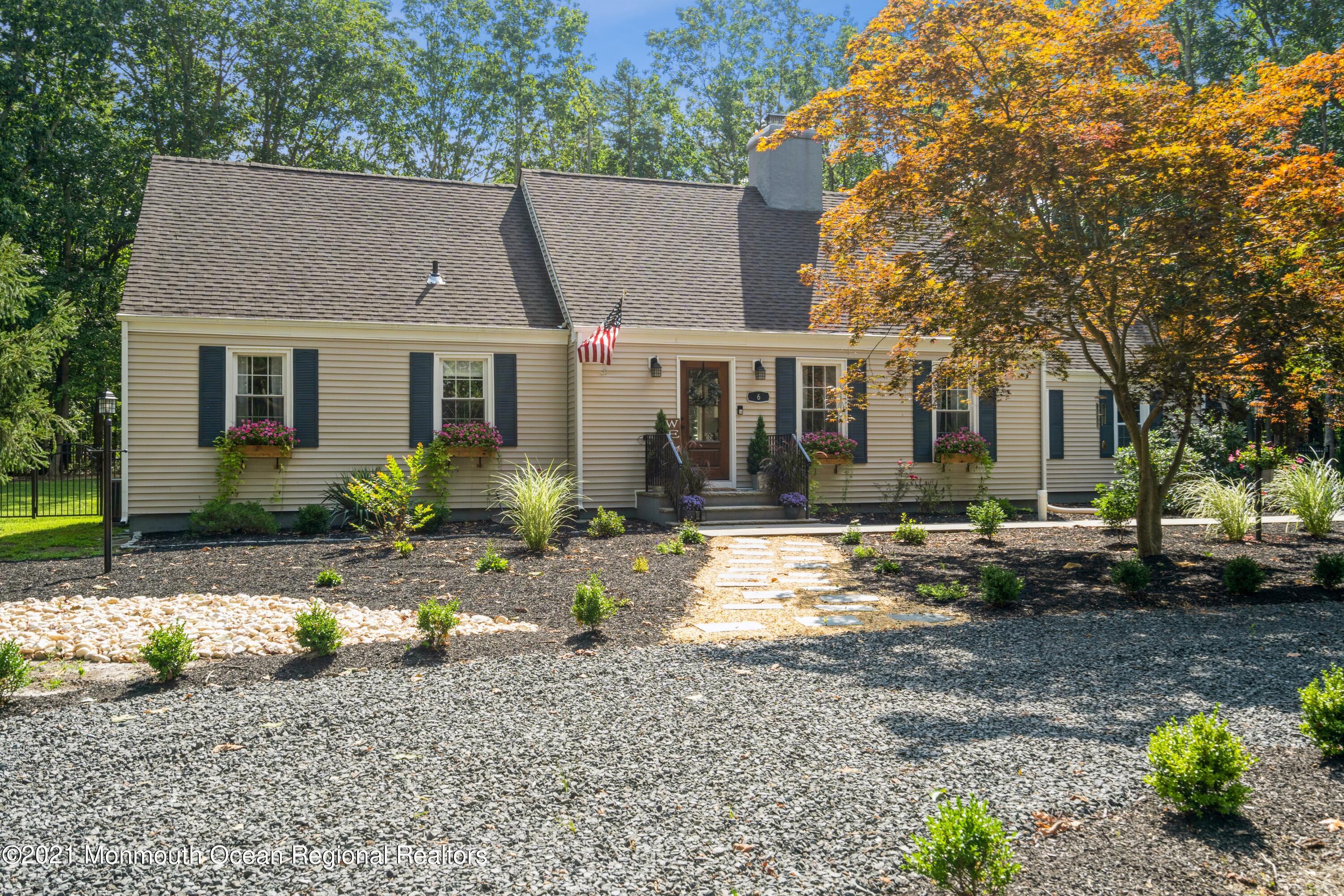6 Brookside Road Millstone Township, NJ 08510 - Photo 1 of 27 a view of a yard in front of a house