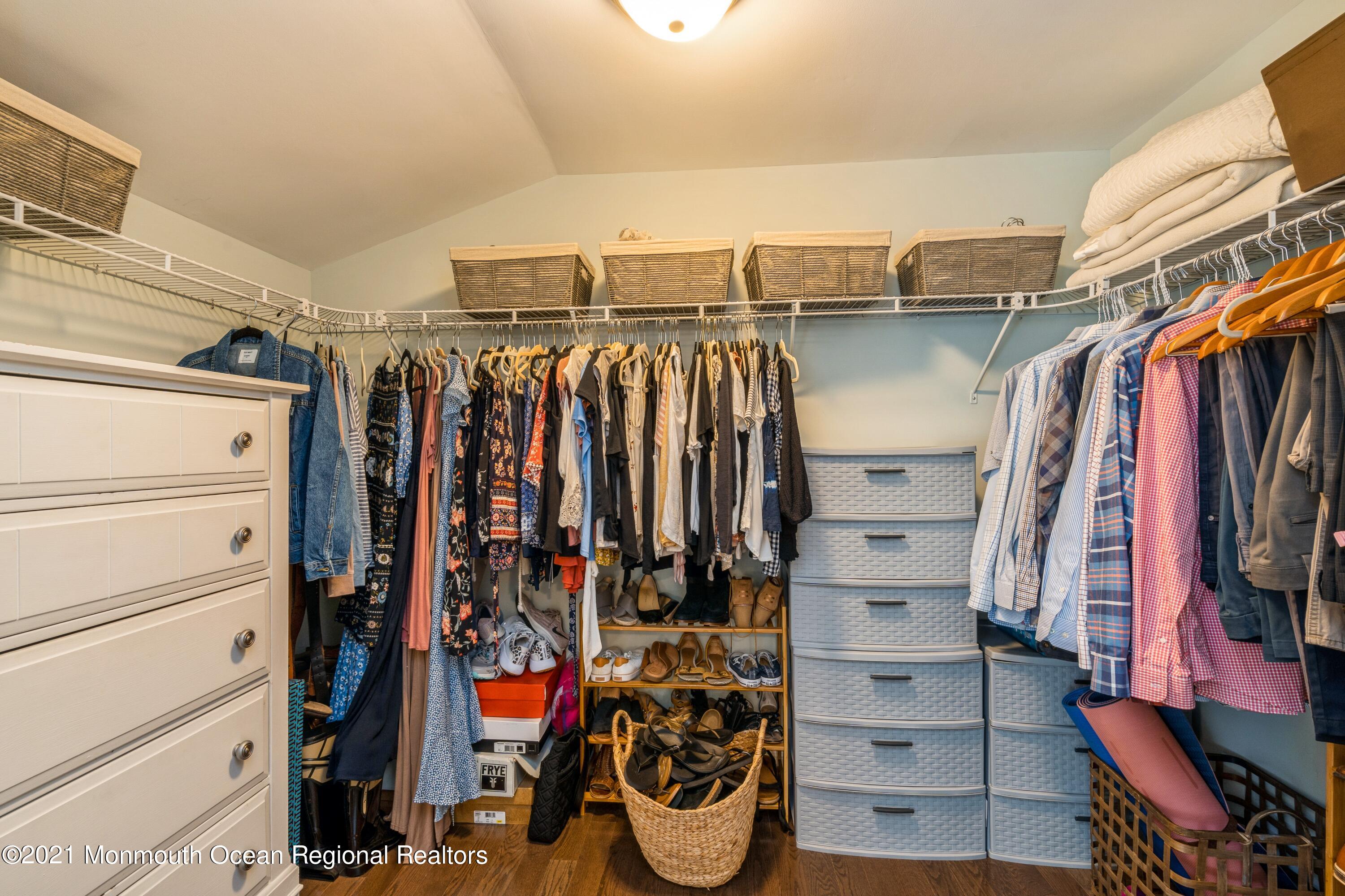 6 Brookside Road Millstone Township, NJ 08510 - Photo 19 of 27 a view of walk in closet with clothes and shoes