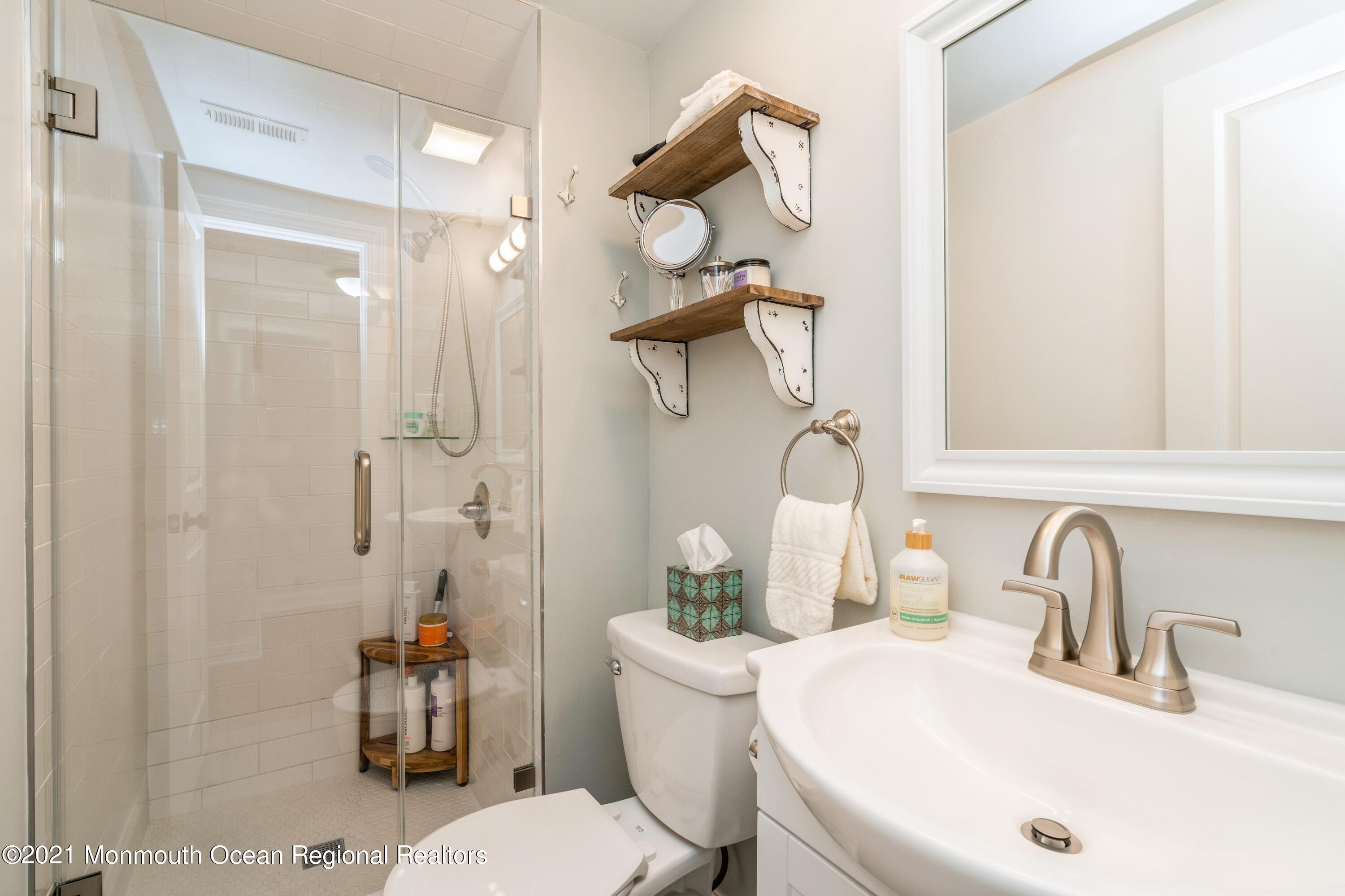 6 Brookside Road Millstone Township, NJ 08510 - Photo 22 of 27 a bathroom with a sink a toilet and shower