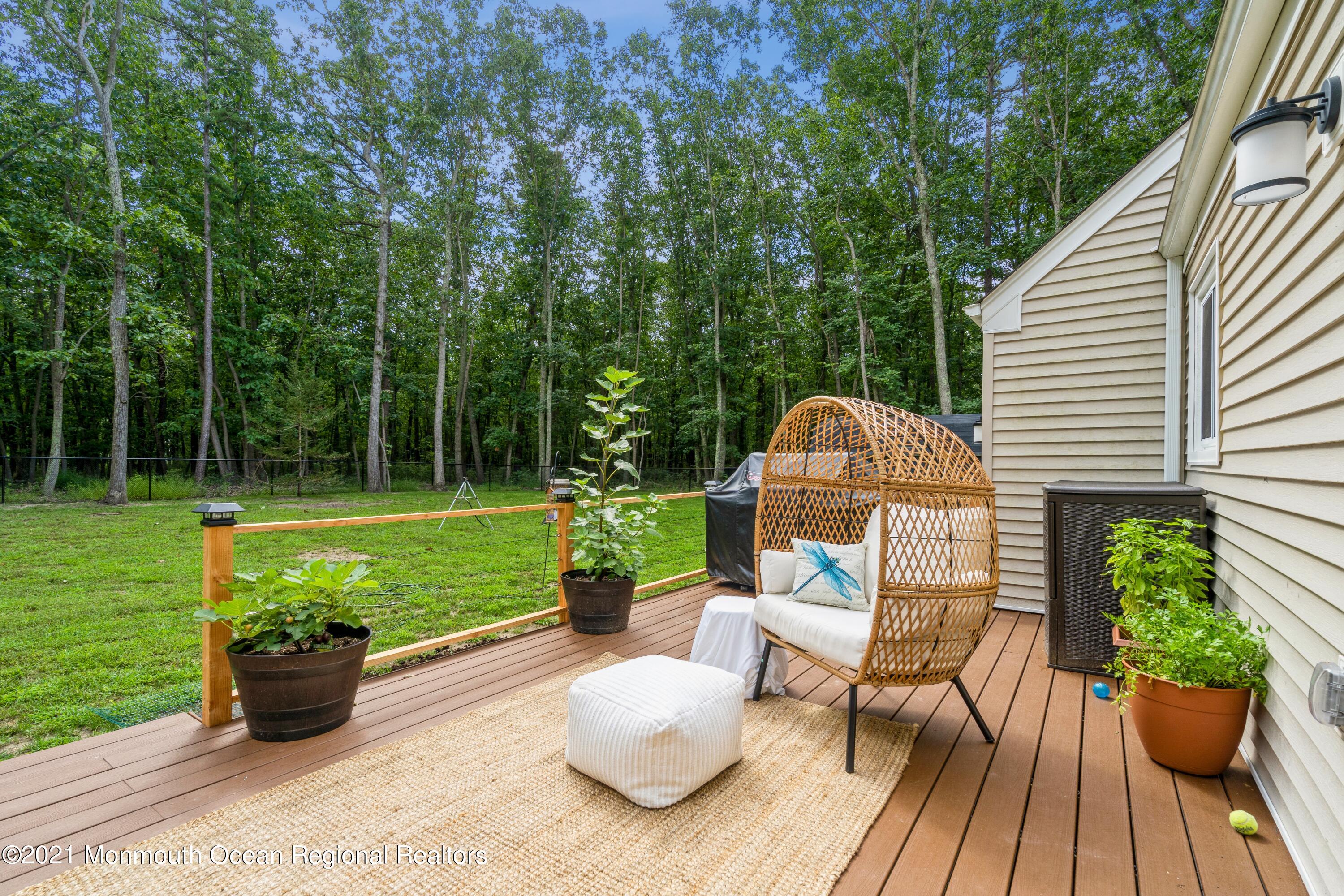 6 Brookside Road Millstone Township, NJ 08510 - Photo 26 of 27 a view of a table and chairs on the roof deck