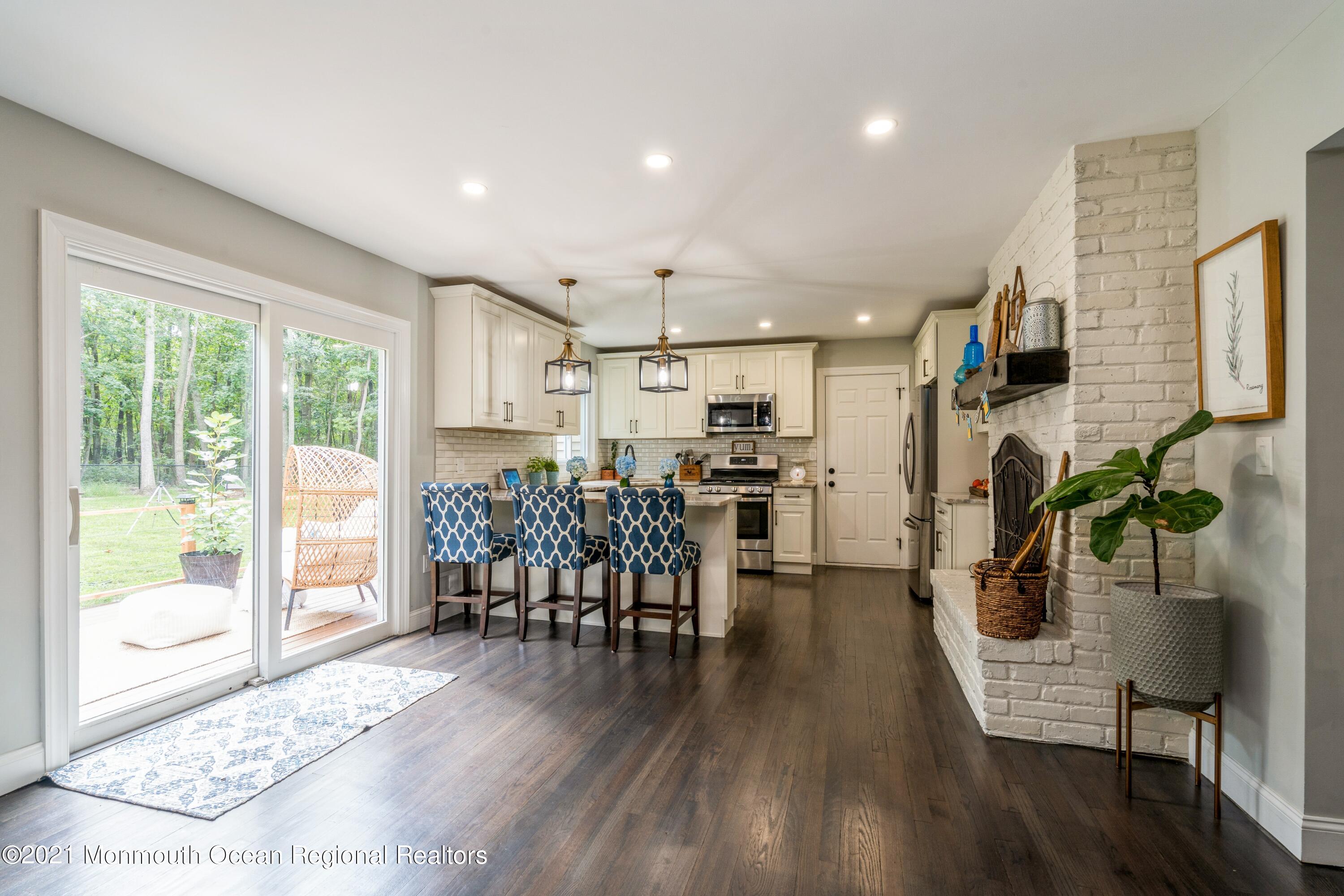 6 Brookside Road Millstone Township, NJ 08510 - Photo 10 of 27 a dining room with furniture and wooden floor