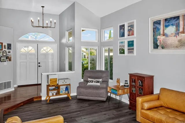 a view of room with window and wooden floor