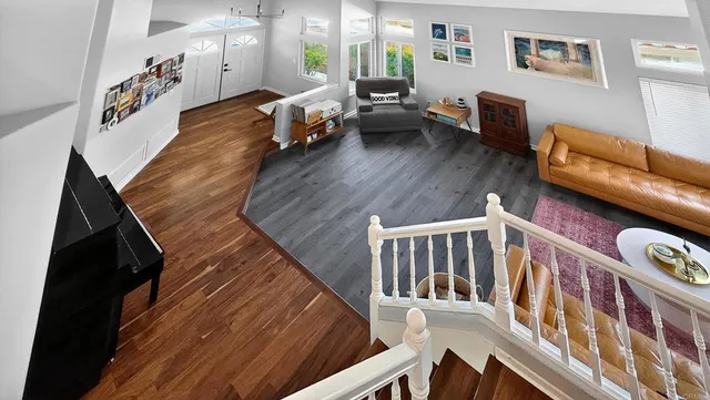 a view of an entryway with wooden floor and windows
