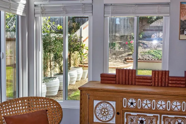 a kitchen with granite countertop a stove top oven microwave and cabinets
