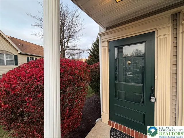 a view of a door and chair in the balcony