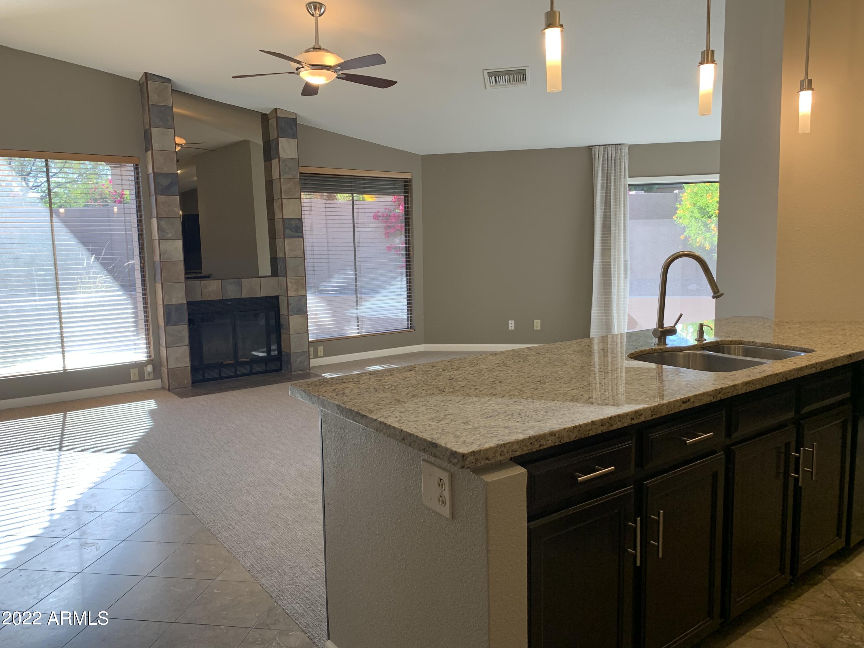 4302 East Bannock Street Phoenix, AZ 85044 - Photo 12 of 55 a bathroom with a sink vanity granite tub and shower